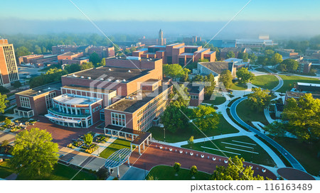 Ball State University campus aerial misty golden morning sunrise over school, Muncie Indiana Ball State University campus aerial misty golden morning sunrise over school, Muncie Indiana 116163489