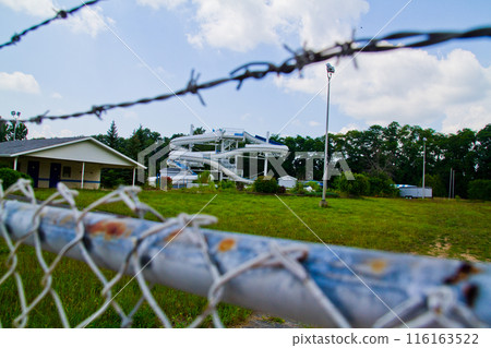 Abandoned Water Park Through Rusty Fence, Fun Spot Indiana Abandoned Water Park Through Rusty Fence, Fun Spot Indiana 116163522