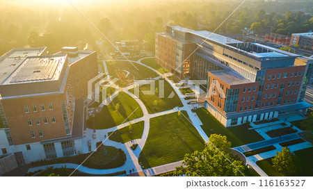 Bright college campus aerial foggy Ball State University on golden dawn sunrise Muncie, IN Bright college campus aerial foggy Ball State University on golden dawn sunrise Muncie, IN 116163527