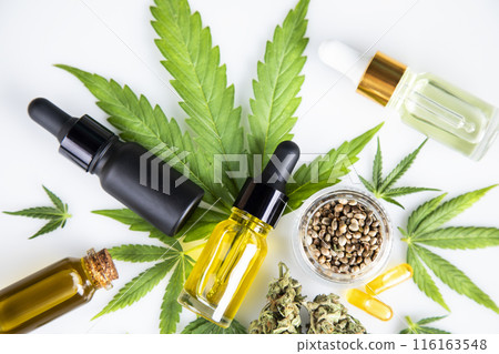 Hemp oil bottle with hemp leaf and cannabis leaf, marijuana Hemp oil bottle with hemp leaf and cannabis leaf, marijuana 116163548