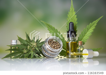 Hemp oil bottle with hemp leaf and cannabis leaf, marijuana Hemp oil bottle with hemp leaf and cannabis leaf, marijuana 116163549