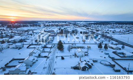 Aerial Winter Sunset Over Snowy Suburban Homes - Fort Wayne 116163793
