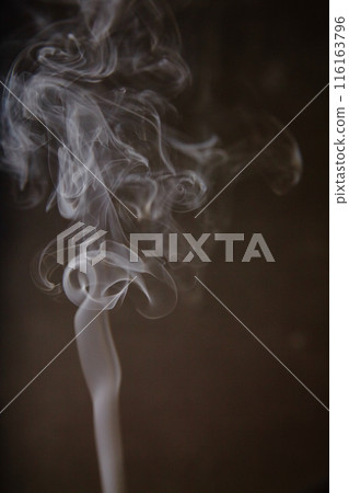 Dancing Smoke Patterns against Dark Backdrop 116163796