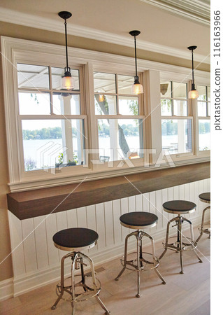 Elegant Cafe Interior with Lakeside View and Industrial Lighting Elegant Cafe Interior with Lakeside View and Industrial Lighting 116163966