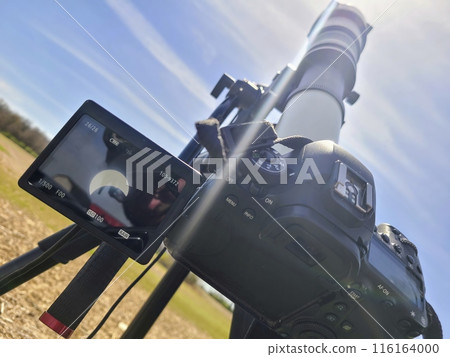 DSLR Camera Captures Eclipse with Telephoto Lens, Outdoor Setup 116164000