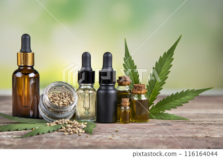 Hemp oil bottle with hemp leaf and cannabis leaf, marijuana 116164044