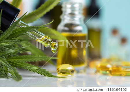 Set of essential oil cbd in a glass bottle, with a pipette, marijuana concept. Set of essential oil cbd in a glass bottle, with a pipette, marijuana concept. 116164102