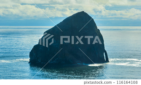 Aerial Tilt of Majestic Coastal Rock Formation in Tranquil Seascape Aerial Tilt of Majestic Coastal Rock Formation in Tranquil Seascape 116164108