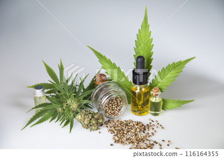 Hemp oil bottle with hemp leaf and cannabis leaf, marijuana Hemp oil bottle with hemp leaf and cannabis leaf, marijuana 116164355