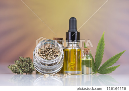 Hemp oil bottle with hemp leaf and cannabis leaf, marijuana Hemp oil bottle with hemp leaf and cannabis leaf, marijuana 116164356