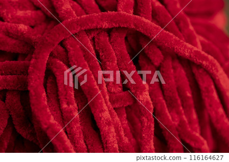 new soft red threads with traces of other threads in close-up new soft red threads with traces of other threads in close-up 116164627