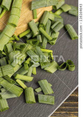 green onions on the table during cooking green onions on the table during cooking 116164643