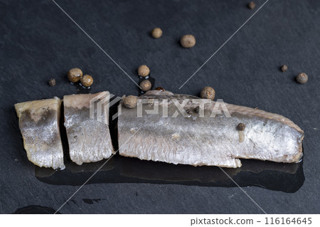 salted herring fillet on the table salted herring fillet on the table 116164645