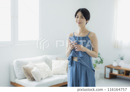 Woman in blue camisole Woman in blue camisole 116164757