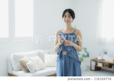 Woman in blue camisole 116164758