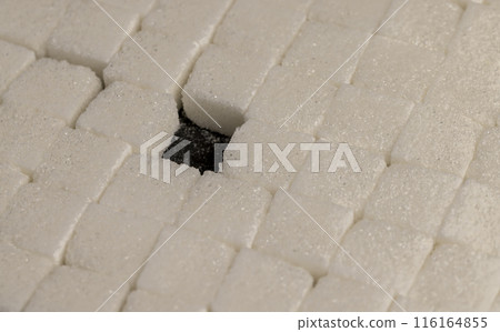 white square sugar on a black background 116164855