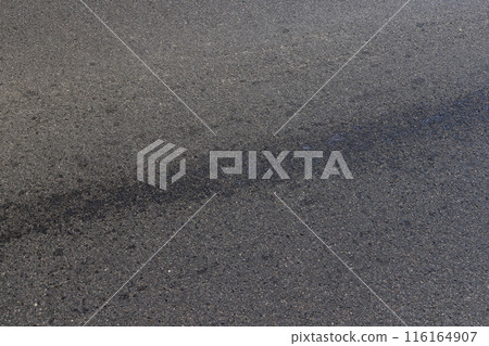 white road markings on asphalt, close up 116164907
