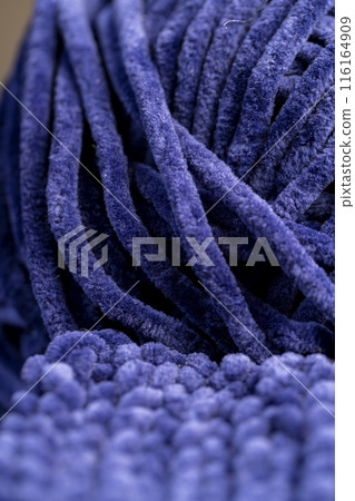 new soft blue threads with traces of other threads in close-up 116164909
