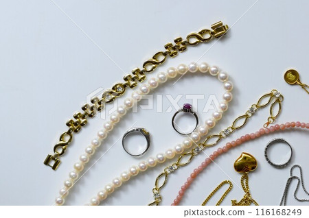 Accessories arranged on a table, luxurious jewelry on a white background 116168249
