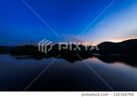Evening view of Nunome Dam in the summer of 2024. Wide-angle shot from before sunset through golden hour to blue hour. Golden hour ⑰ 116168768