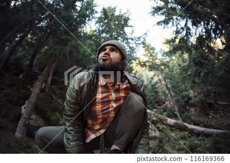 Man Howling in Forest with Wild and Primal Expression Man Howling in Forest with Wild and Primal Expression 116169366