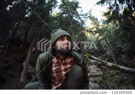Man Making Funny Face in Forest During Outdoor Adventure Man Making Funny Face in Forest During Outdoor Adventure 116169369