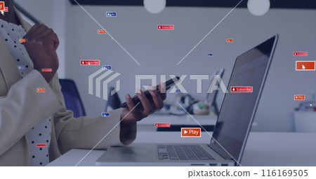 Image of social media icons with texts over african american woman using smartphone and laptop 116169505