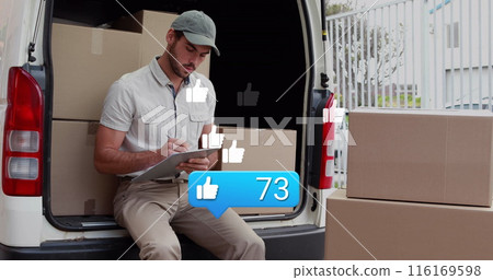 Image of notification label and thumbs up icons, caucasian man writing box details in notepad 116169598