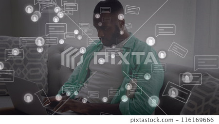 Image of message and profile icons, african american man sitting on sofa and working on computer Image of message and profile icons, african american man sitting on sofa and working on computer 116169666