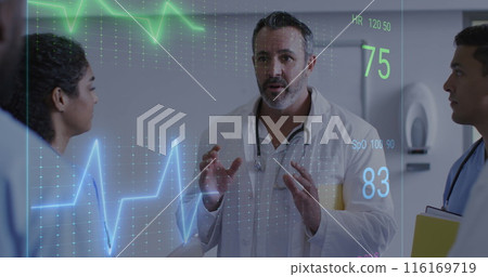Image of heart rate monitor over biracial male doctor discussing with his team at hospital 116169719