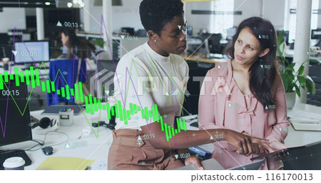 Image of multiple graphs with changing numbers, diverse female coworkers discussing on desk Image of multiple graphs with changing numbers, diverse female coworkers discussing on desk 116170013