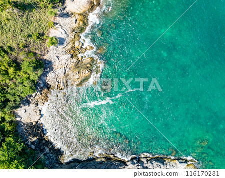 Amazing seascape view seashore and big waves crashing on rocks, Aerial view waves sea surface in Phuket island Thailand 116170281