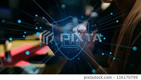 Image of padlock in shield over biracial woman scrolling on smartphone 116170799