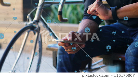 Image of connected icons, biracial man looking at smartwatch and scrolling on cellphone Image of connected icons, biracial man looking at smartwatch and scrolling on cellphone 116170807