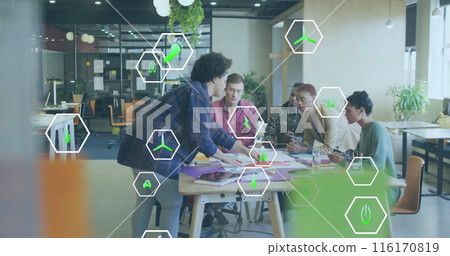 Image of icon in hexagons over diverse coworkers sharing ideas in office Image of icon in hexagons over diverse coworkers sharing ideas in office 116170819