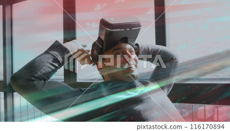 Image of scope scanning and data processing over man wearing vr headset 116170894