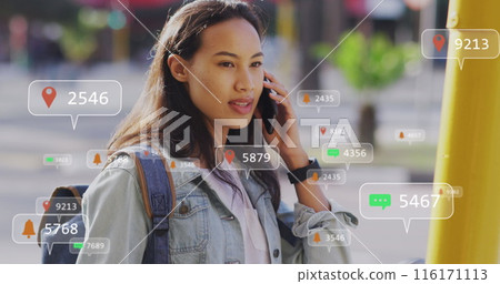Image of social media data processing over asian woman using smartphone in city Image of social media data processing over asian woman using smartphone in city 116171113
