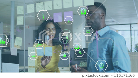 Image of icon in hexagons over diverse coworkers discussing reports on transparent board 116171166