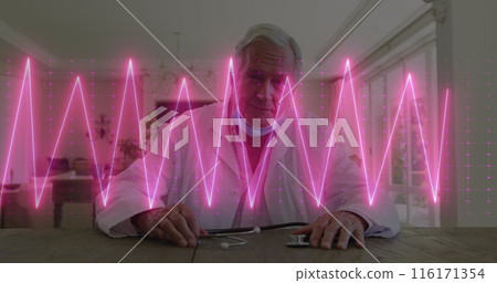 Image of heart rate monitor over caucasian male senior doctor having a image call at home 116171354