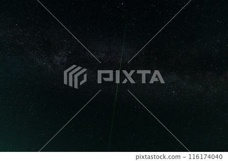 Night sky with stars and green laser beam Night sky with stars and green laser beam 116174040