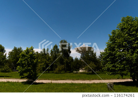 Distant view of radio telescope dish Distant view of radio telescope dish 116174261