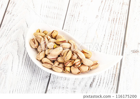 Salted tasty pistachio nuts heap 116175200