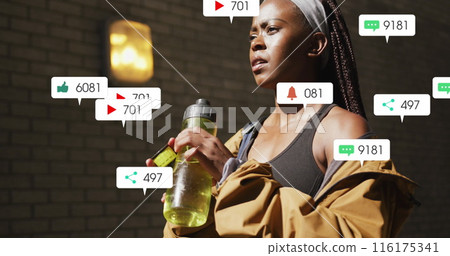 Image of icons, changing numbers, african american female athlete drinking water Image of icons, changing numbers, african american female athlete drinking water 116175341