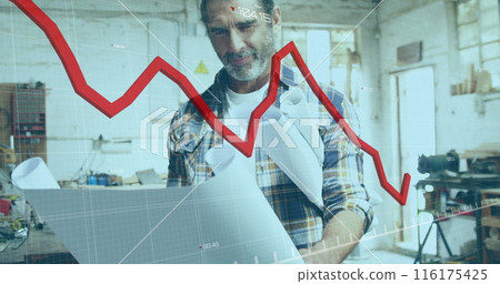 Image of red graph processing over mature caucasian male carpenter with blueprints in workshop 116175425