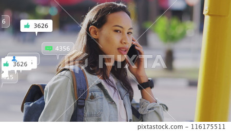 Image of multiple notification bars over smiling asian woman talking on smartphone 116175511
