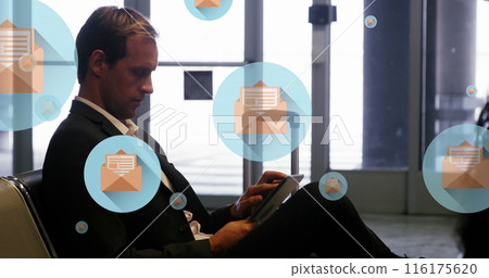 Image of message icons floating over caucasian businessman using digital tablet at an airport 116175620