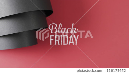 Image of black friday text over rolled up black paper on red background Image of black friday text over rolled up black paper on red background 116175652