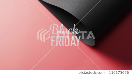 Image of black friday text over rolled up black paper on red background Image of black friday text over rolled up black paper on red background 116175656