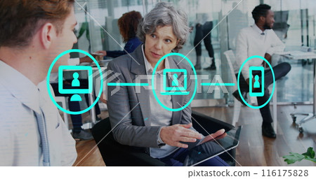 Image of network of icons over diverse businessman and businesswoman discussing at office 116175828