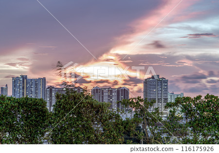 Gorgeous scenic of sunset with beautiful cloud and sky over metropolitan city. Gorgeous scenic of sunset with beautiful cloud and sky over metropolitan city. 116175926